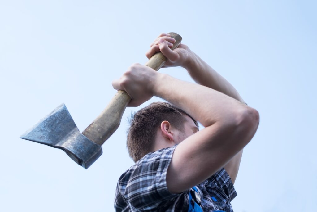 Man with an axe held over his head.