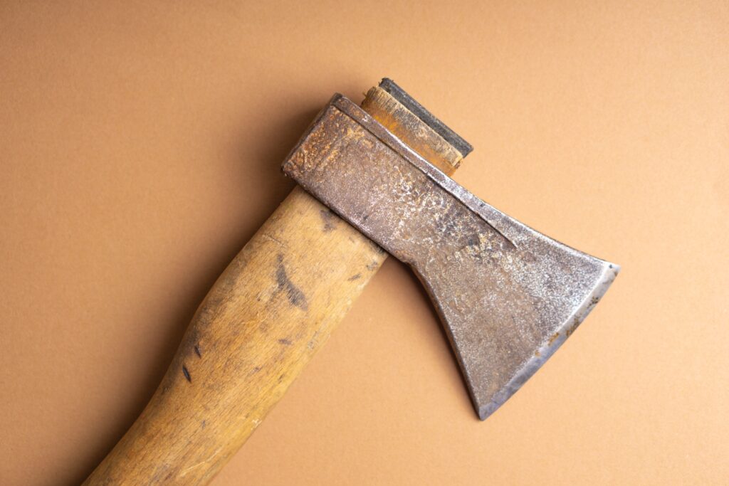 An axe with scuff marks with a blank background.