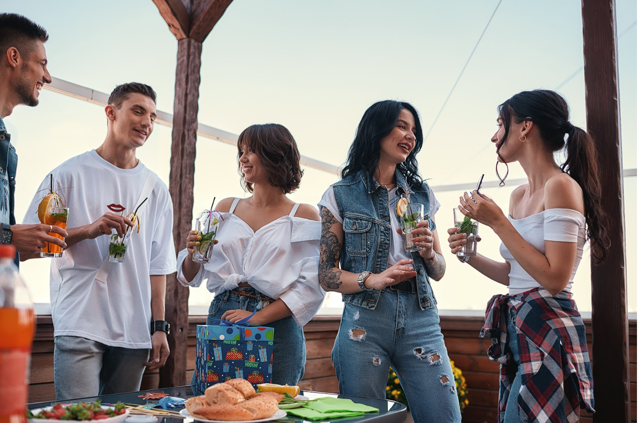 A group of friends with drinks at a party.