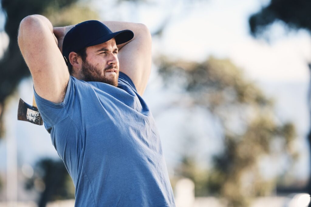 A man practicing axe-throwing.